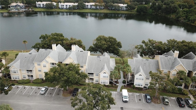 birds eye view of property with a water view