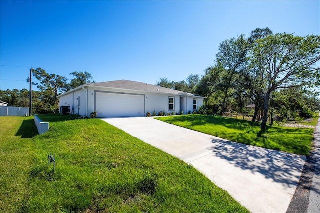 ranch-style house with a garage and a front yard