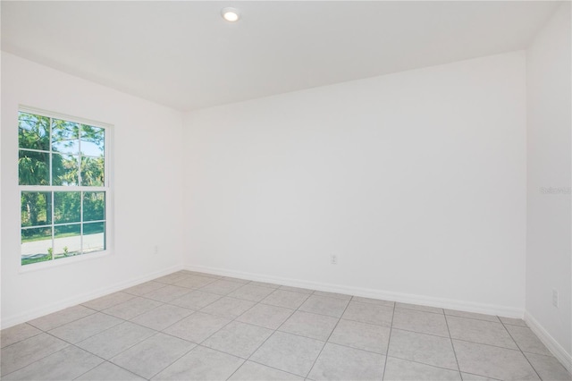 empty room with light tile patterned floors