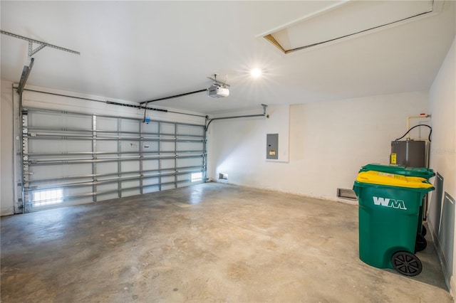 garage featuring electric panel, a garage door opener, and water heater