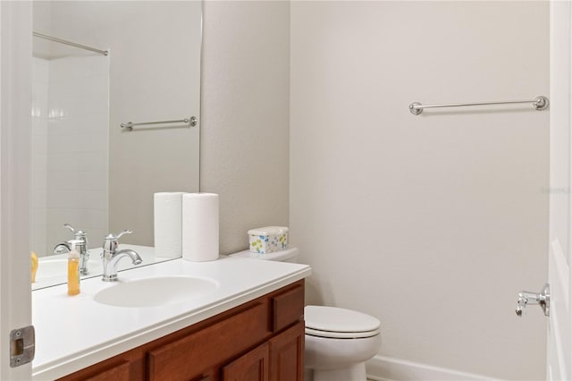 bathroom featuring toilet and vanity