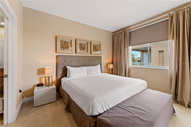 bedroom featuring light colored carpet