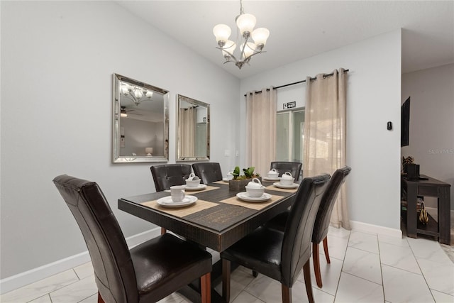 dining area with ceiling fan with notable chandelier