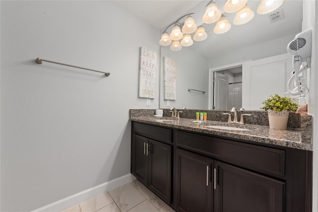 bathroom featuring vanity and a shower with shower door