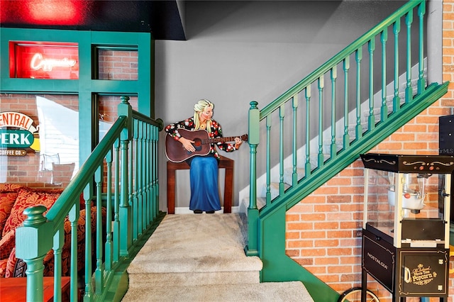 staircase featuring carpet flooring