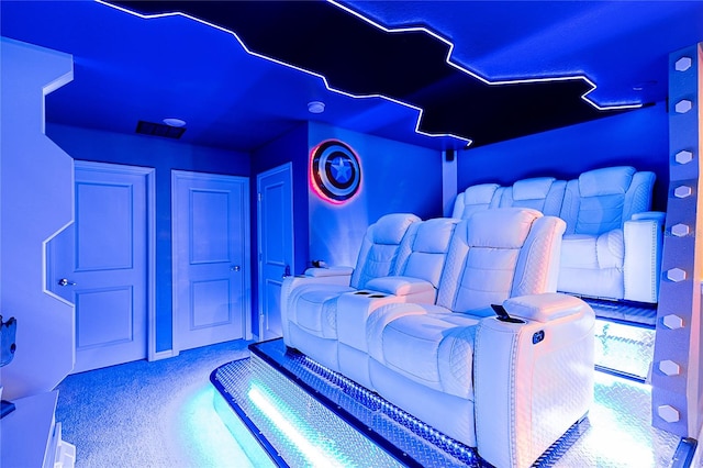 cinema room featuring light colored carpet