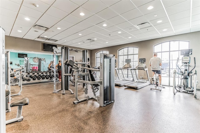 workout area with a paneled ceiling