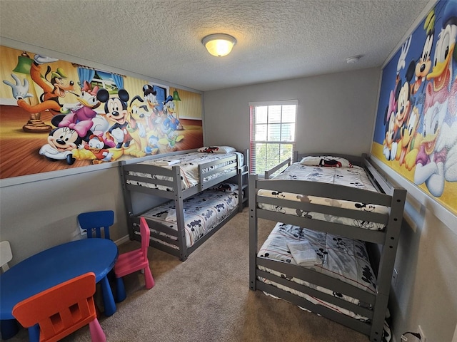 bedroom featuring carpet and a textured ceiling