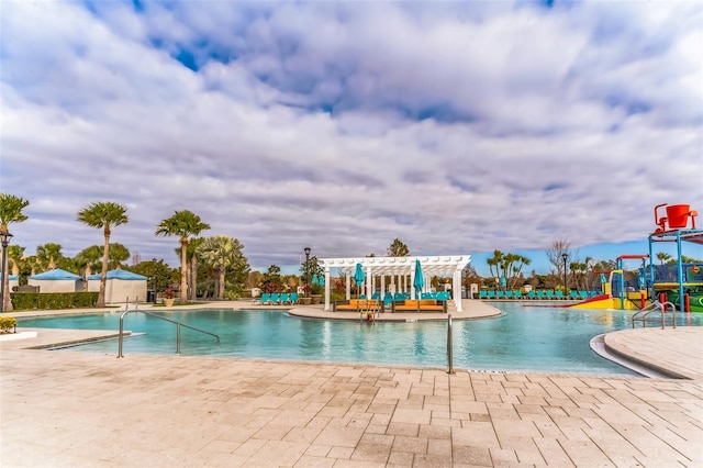 view of pool with a pergola and a patio