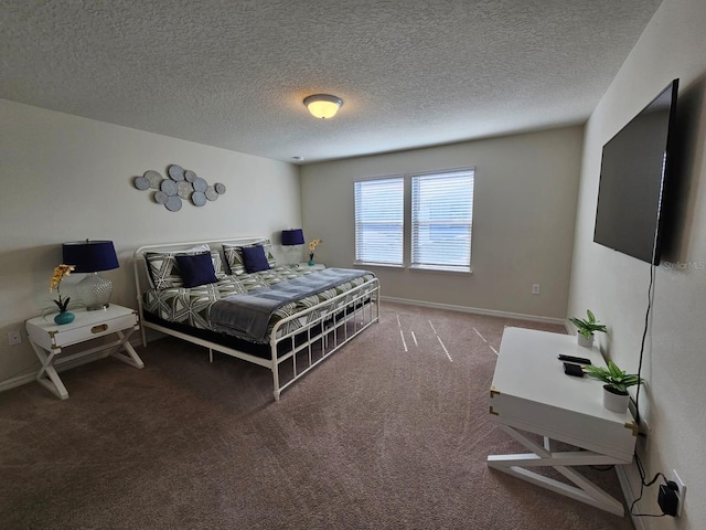 carpeted bedroom featuring a textured ceiling