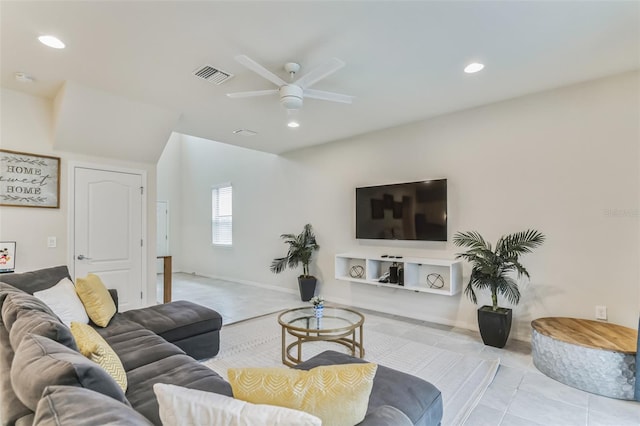 living room featuring light tile patterned floors and ceiling fan