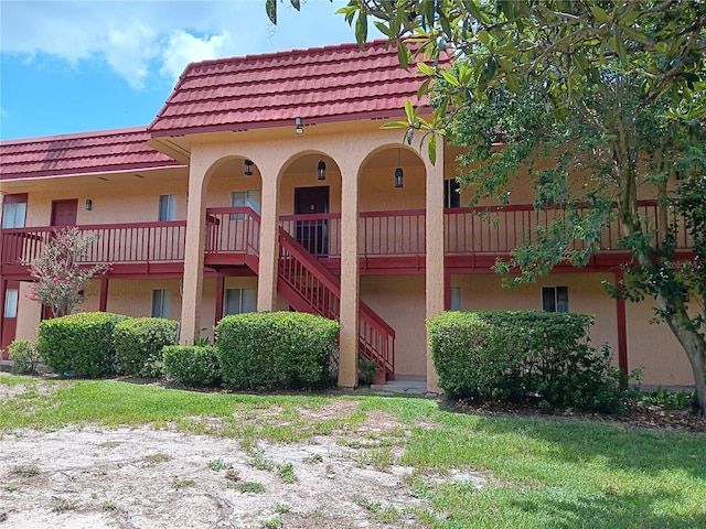 view of property featuring stairway