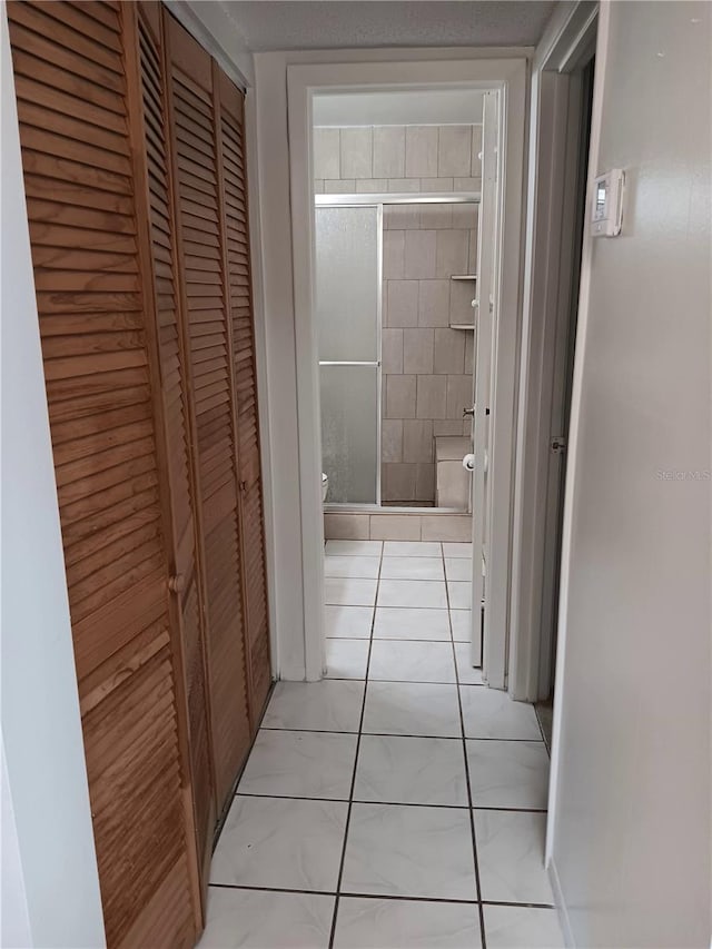 hallway with light tile patterned flooring