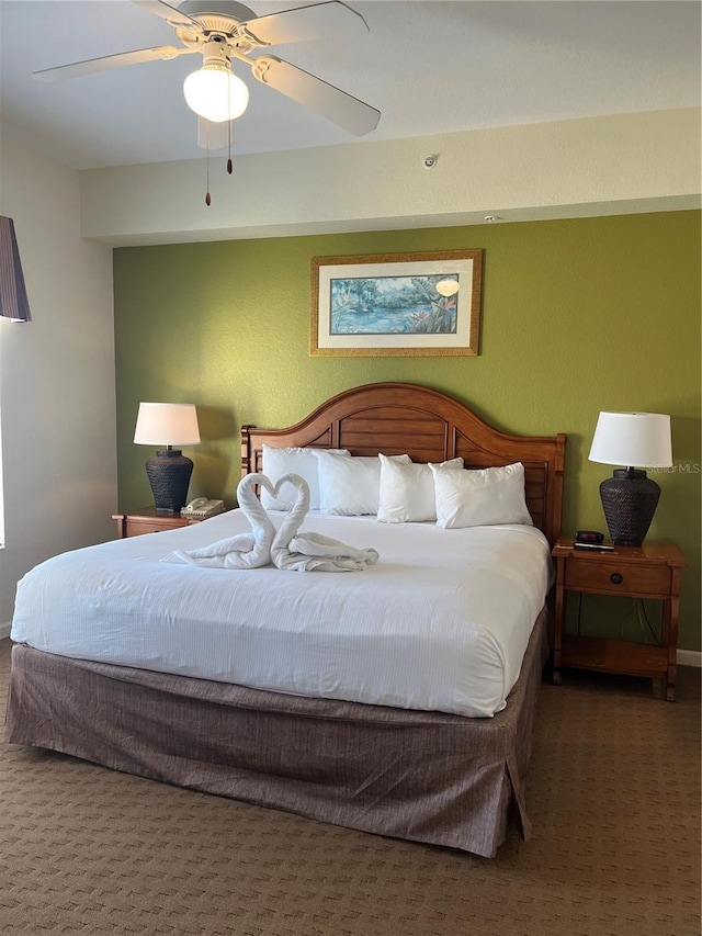 carpeted bedroom featuring ceiling fan