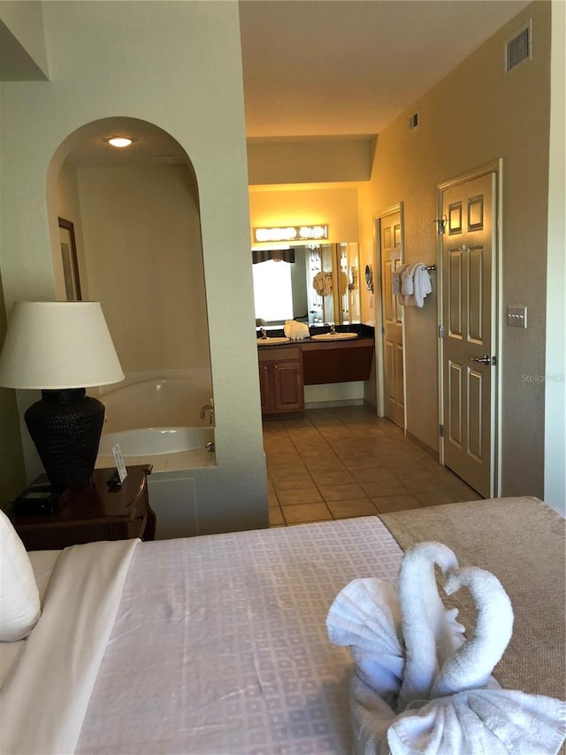 bedroom with light tile floors