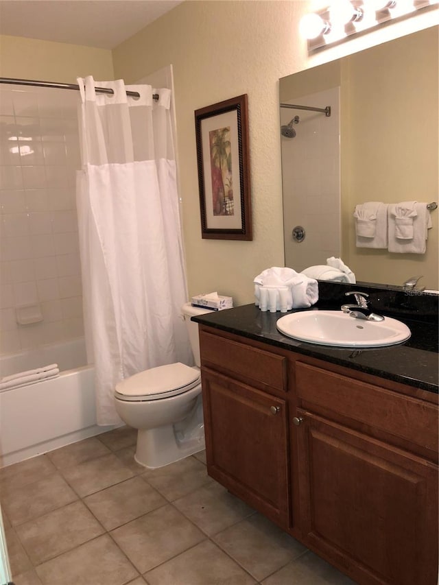 full bathroom with toilet, shower / tub combo, large vanity, and tile flooring