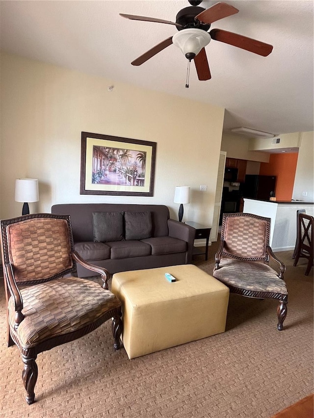8112 Poinciana Blvd Unit 1605, Orlando, FL 32821 - living room with ceiling fan, carpet flooring, and visible vents