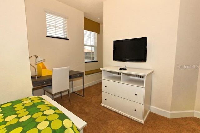 bedroom featuring carpet flooring and baseboards