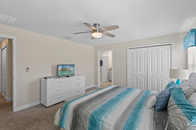 carpeted bedroom featuring a closet and ceiling fan