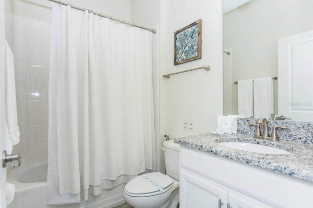 full bathroom featuring shower / bath combo, toilet, and vanity