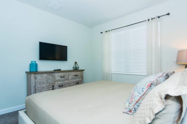 bedroom with dark carpet