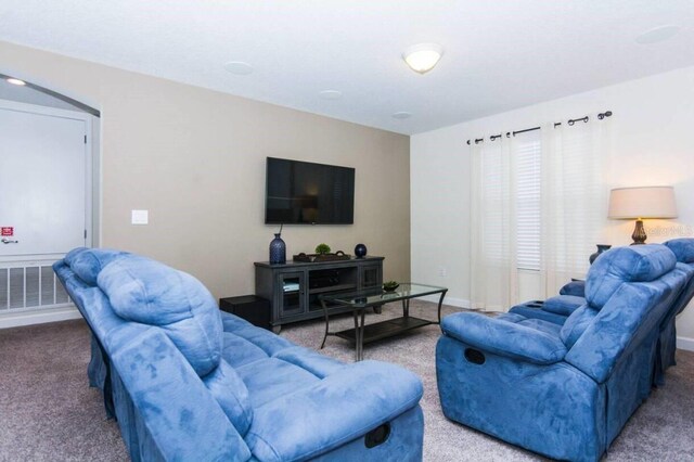 living room with light colored carpet