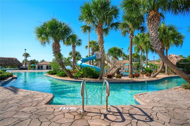 view of pool with a water slide