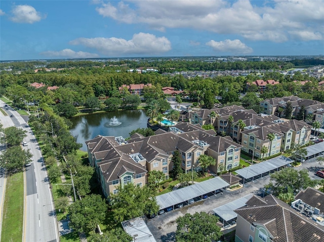 drone / aerial view featuring a water view and a residential view