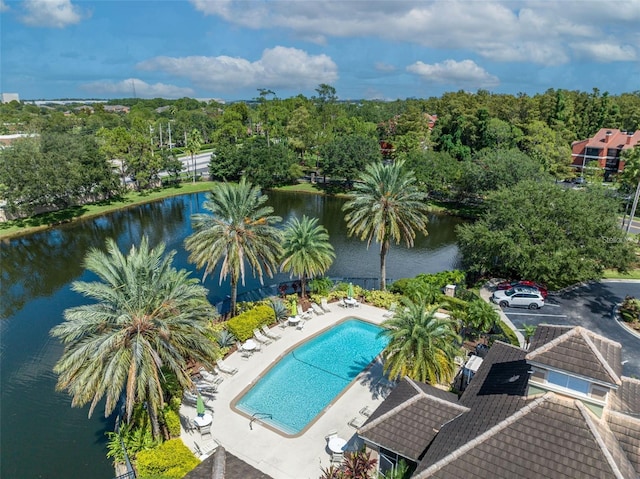 pool with a water view and a patio area