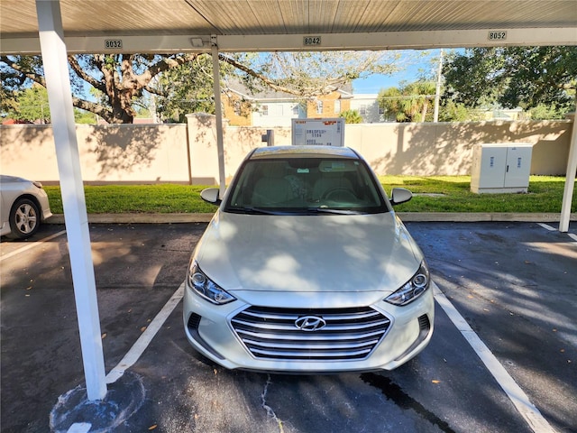 uncovered parking lot with fence