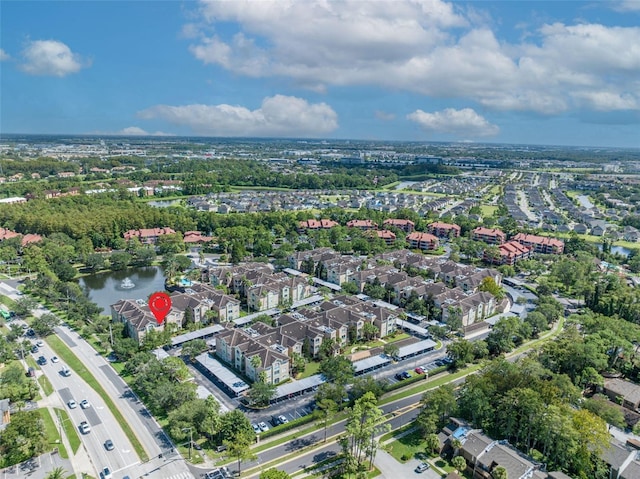 birds eye view of property featuring a water view and a residential view