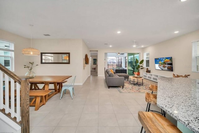 tiled dining area with a wealth of natural light