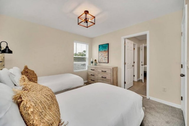 bedroom featuring light carpet