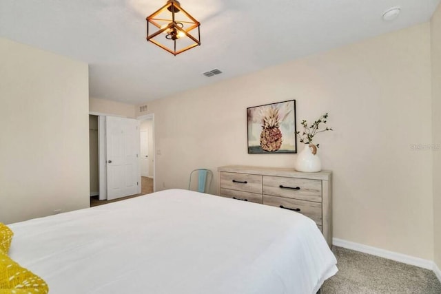 bedroom featuring light carpet