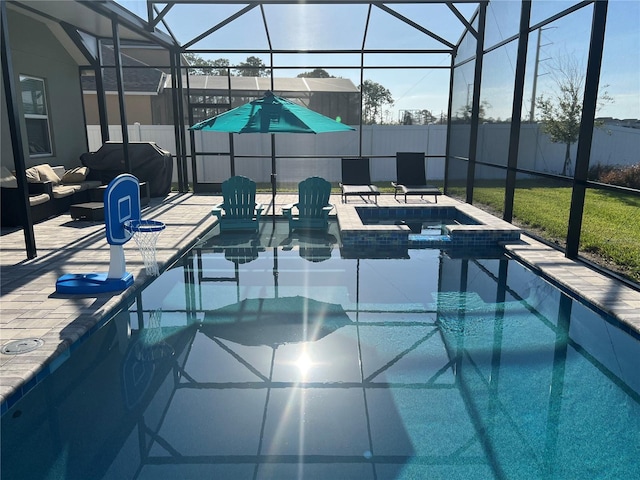 view of pool with grilling area, an in ground hot tub, a patio, and glass enclosure