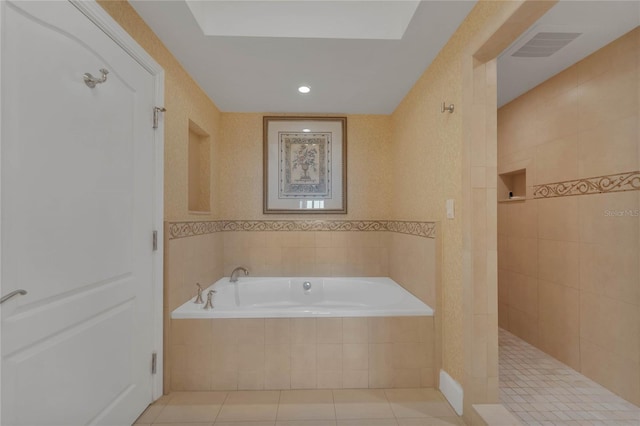 bathroom featuring independent shower and bath and tile floors