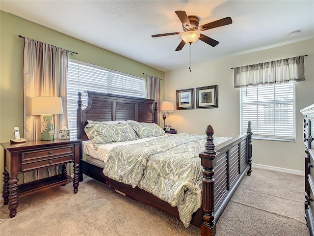 bedroom with light carpet and ceiling fan