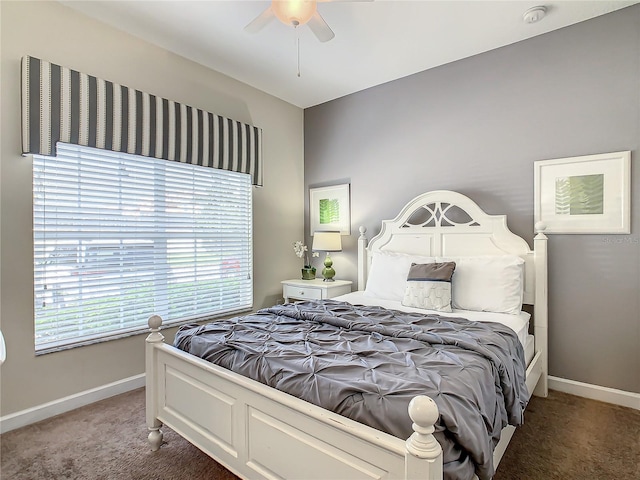 bedroom with dark carpet and ceiling fan