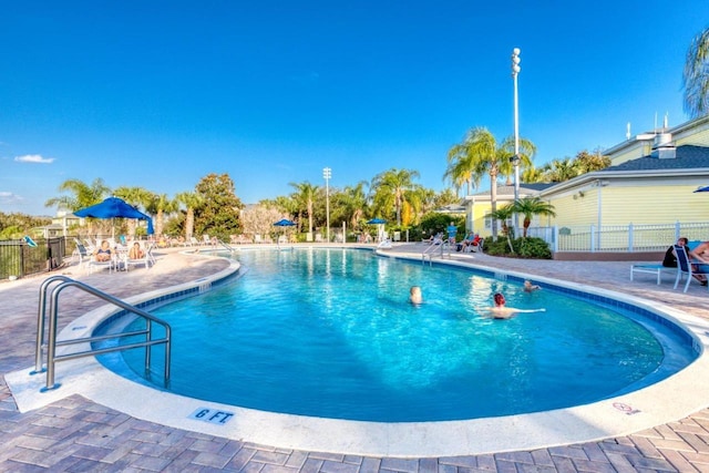 view of pool featuring a patio