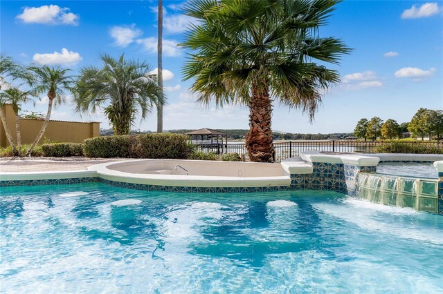 view of pool with fence and a fenced in pool