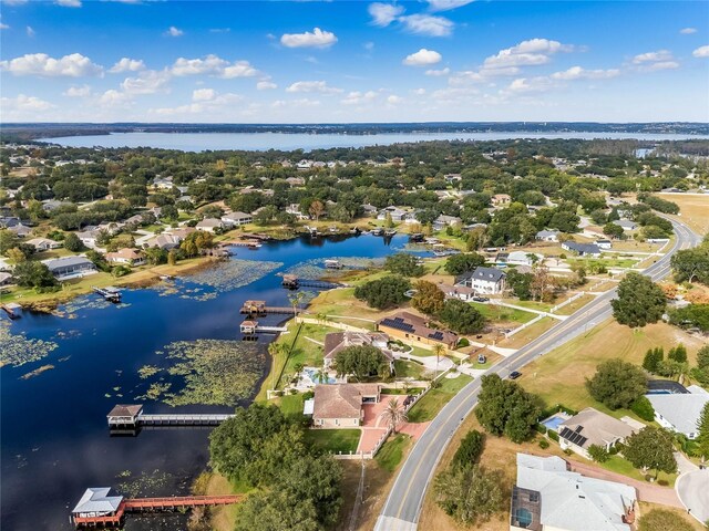 birds eye view of property featuring a residential view and a water view