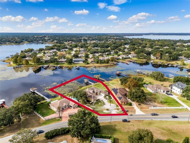 bird's eye view with a residential view and a water view