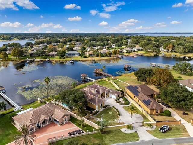 birds eye view of property with a residential view and a water view