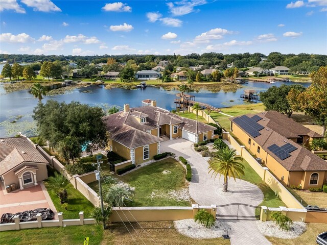 birds eye view of property featuring a residential view and a water view