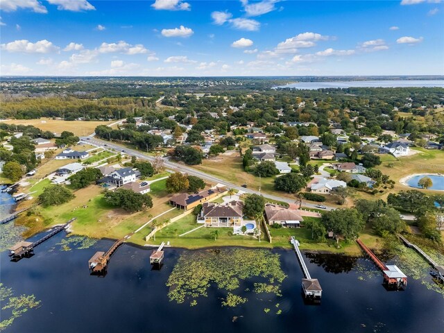 bird's eye view with a residential view and a water view