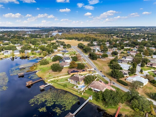 birds eye view of property with a residential view and a water view