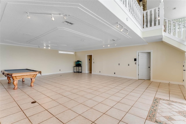 interior space with light tile patterned floors, a healthy amount of sunlight, and baseboards