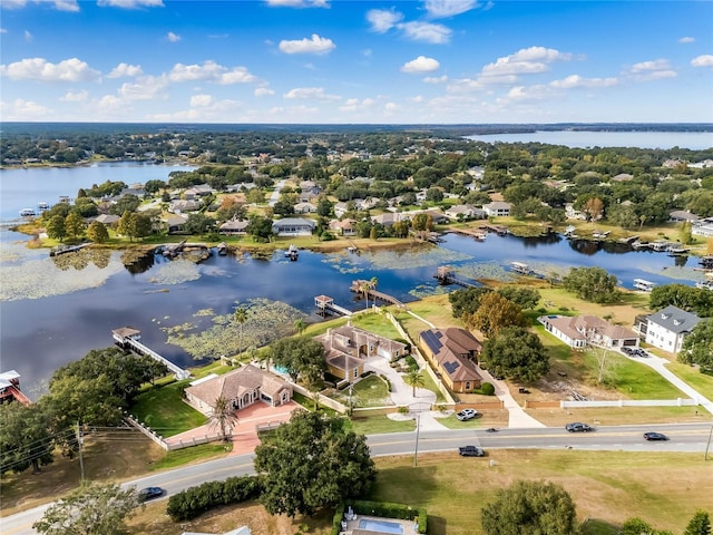 bird's eye view with a residential view and a water view