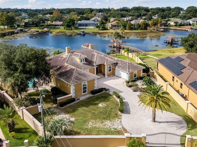 birds eye view of property with a residential view and a water view