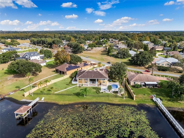 aerial view featuring a residential view and a water view